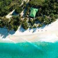 aerial-shot-maldives-showing-amazing-beach-clear-blue-sea-jungles_181624-3948